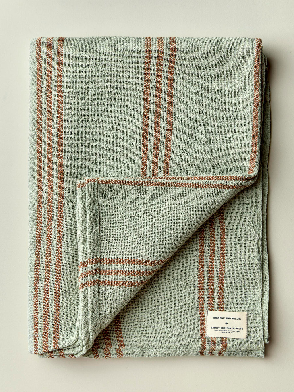 i+w x family heirloom weavers cotton throw in sage stripe